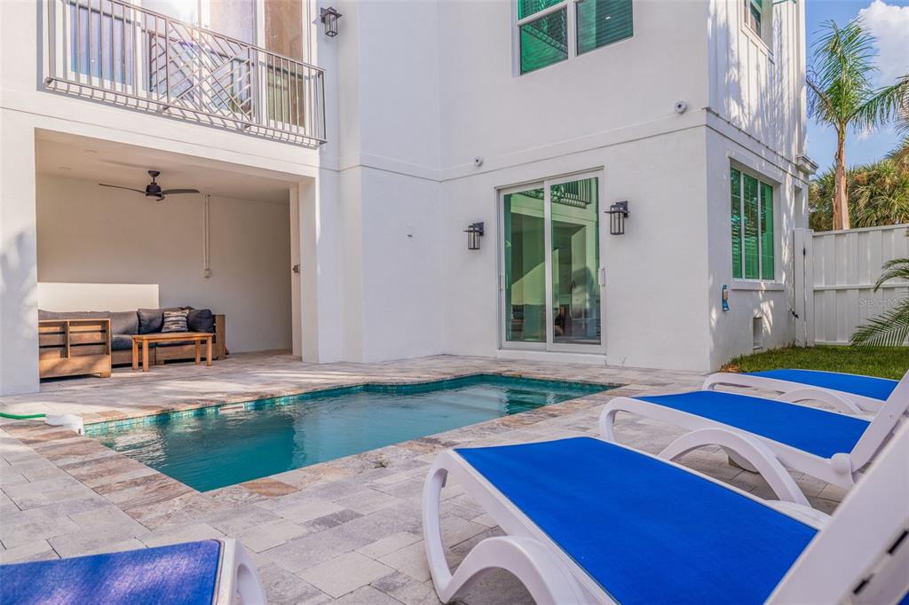 1800 Gulf Boulevard, Unit 1 Indian Rocks Beach, FL 33785 - Photo 16 of 97 a view of backyard with swimming pool and outdoor seating