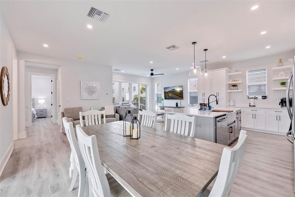 1800 Gulf Boulevard, Unit 1 Indian Rocks Beach, FL 33785 - Photo 22 of 97 a large kitchen with a table and chairs