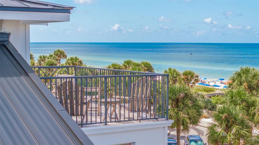 1800 Gulf Boulevard, Unit 1 Indian Rocks Beach, FL 33785 - Photo 3 of 97 a view of a balcony with two chairs