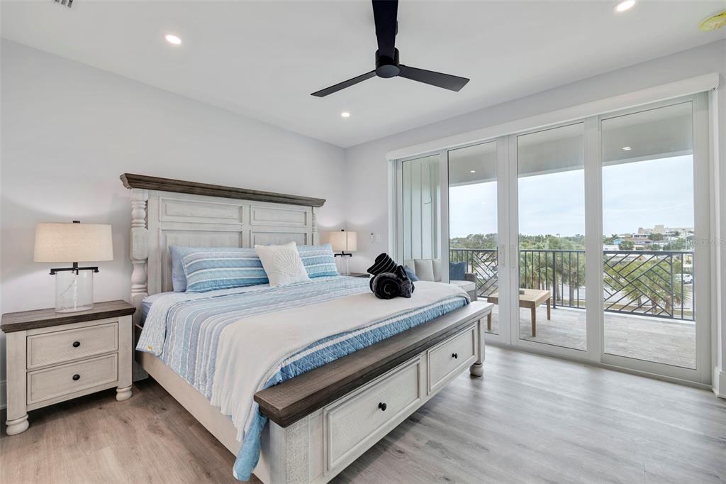 1800 Gulf Boulevard, Unit 1 Indian Rocks Beach, FL 33785 - Photo 32 of 97 a bedroom with a bed and a large window
