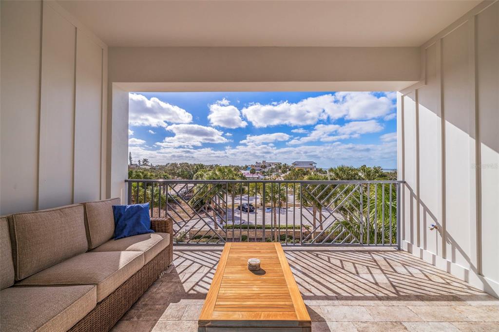 1800 Gulf Boulevard, Unit 1 Indian Rocks Beach, FL 33785 - Photo 47 of 97 a view of a balcony with furniture and wooden floor