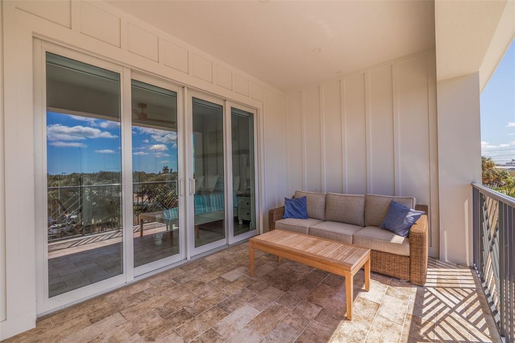 1800 Gulf Boulevard, Unit 1 Indian Rocks Beach, FL 33785 - Photo 50 of 97 a bedroom with furniture and a window