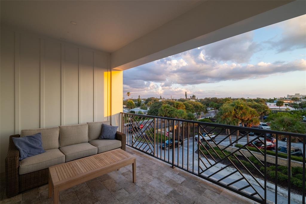 1800 Gulf Boulevard, Unit 1 Indian Rocks Beach, FL 33785 - Photo 54 of 97 a view of a balcony with couches and wooden floor