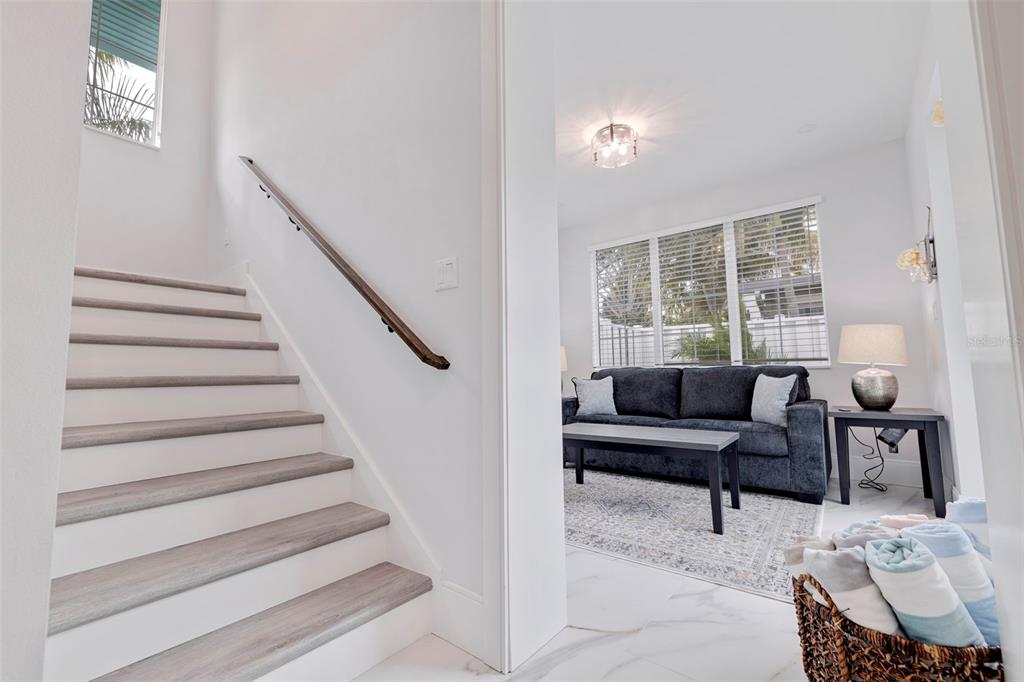 1800 Gulf Boulevard, Unit 1 Indian Rocks Beach, FL 33785 - Photo 6 of 97 a view of livingroom with furniture and staircase