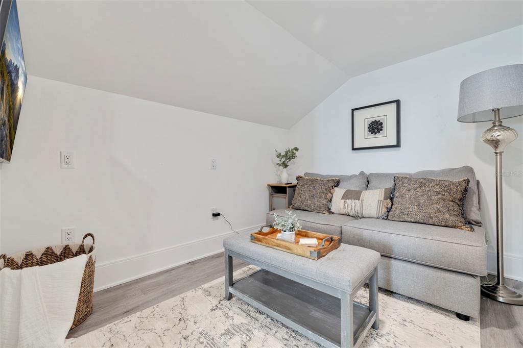 1800 Gulf Boulevard, Unit 1 Indian Rocks Beach, FL 33785 - Photo 62 of 97 a living room with furniture and a couch