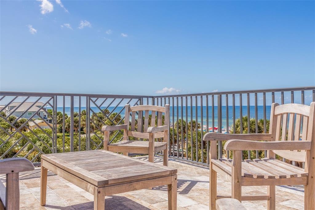 1800 Gulf Boulevard, Unit 1 Indian Rocks Beach, FL 33785 - Photo 69 of 97 a view of a chairs and table on the deck
