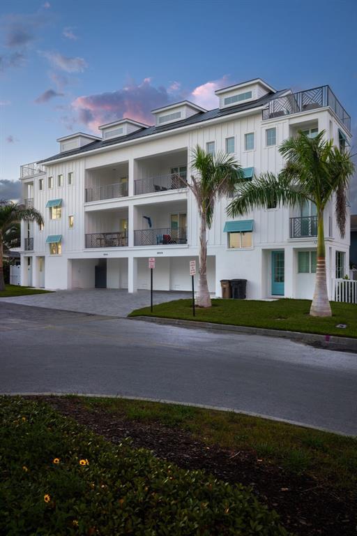 1800 Gulf Boulevard, Unit 1 Indian Rocks Beach, FL 33785 - Photo 69 of 97 a front view of a house with a garden