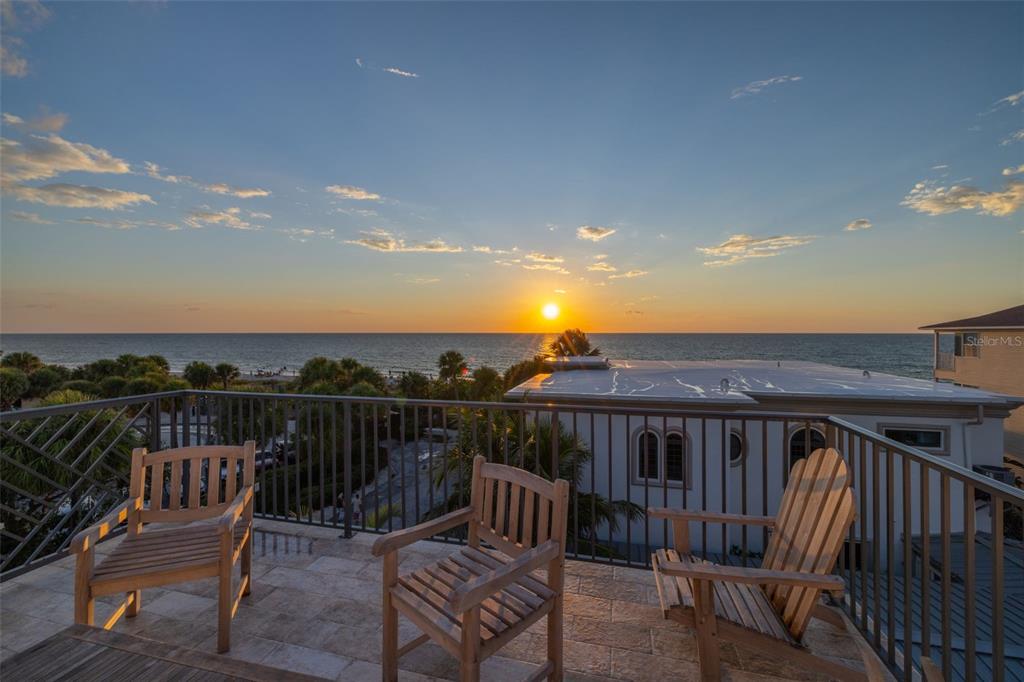 1800 Gulf Boulevard, Unit 1 Indian Rocks Beach, FL 33785 - Photo 89 of 97 a view of a roof deck with chair and wooden floor