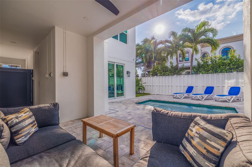 1800 Gulf Boulevard, Unit 1 Indian Rocks Beach, FL 33785 - Photo 10 of 97 a living room with furniture and a potted plant
