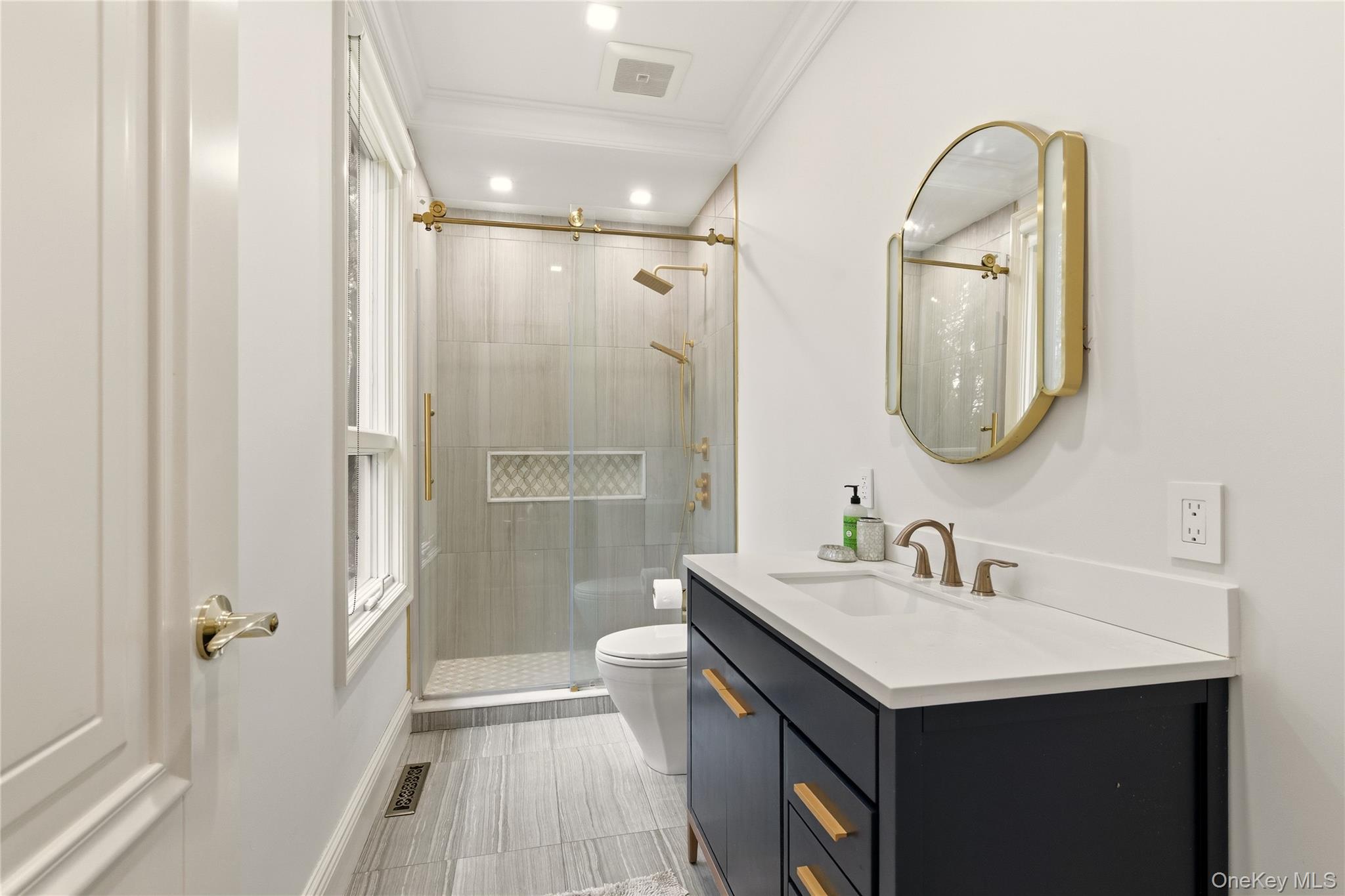 55 Coves Run Syosset, NY 11791 - Photo 36 of 50 a bathroom with a double vanity sink mirror and shower