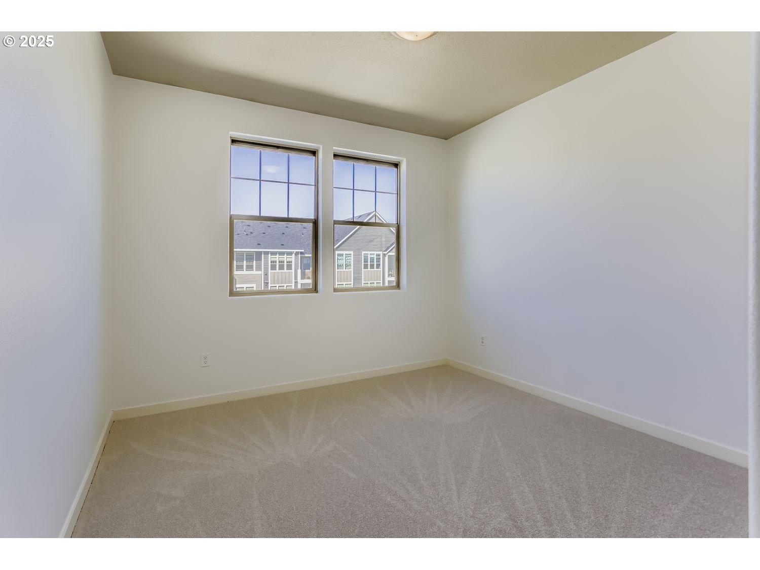 16449 Northwest Chadwick Way, Unit 305 Portland, OR 97229 - Photo 8 of 11 a view of an empty room with a window