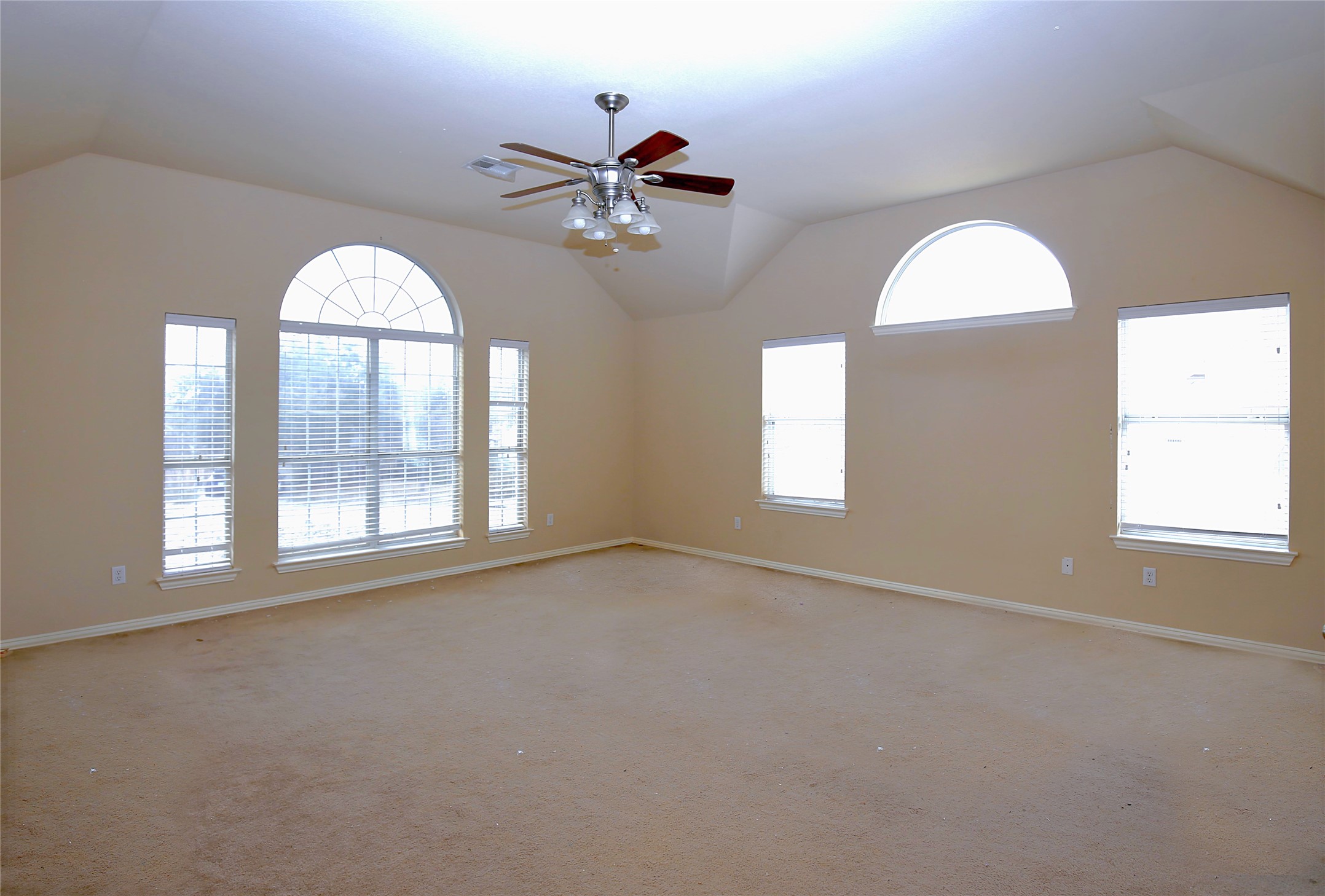 2002 Singing Hills Leander, TX 78641 - Photo 14 of 31 an empty room with windows and fan