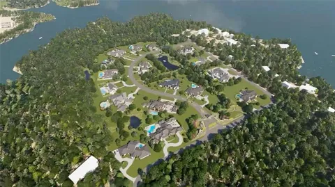 an aerial view of a house with garden space and street view