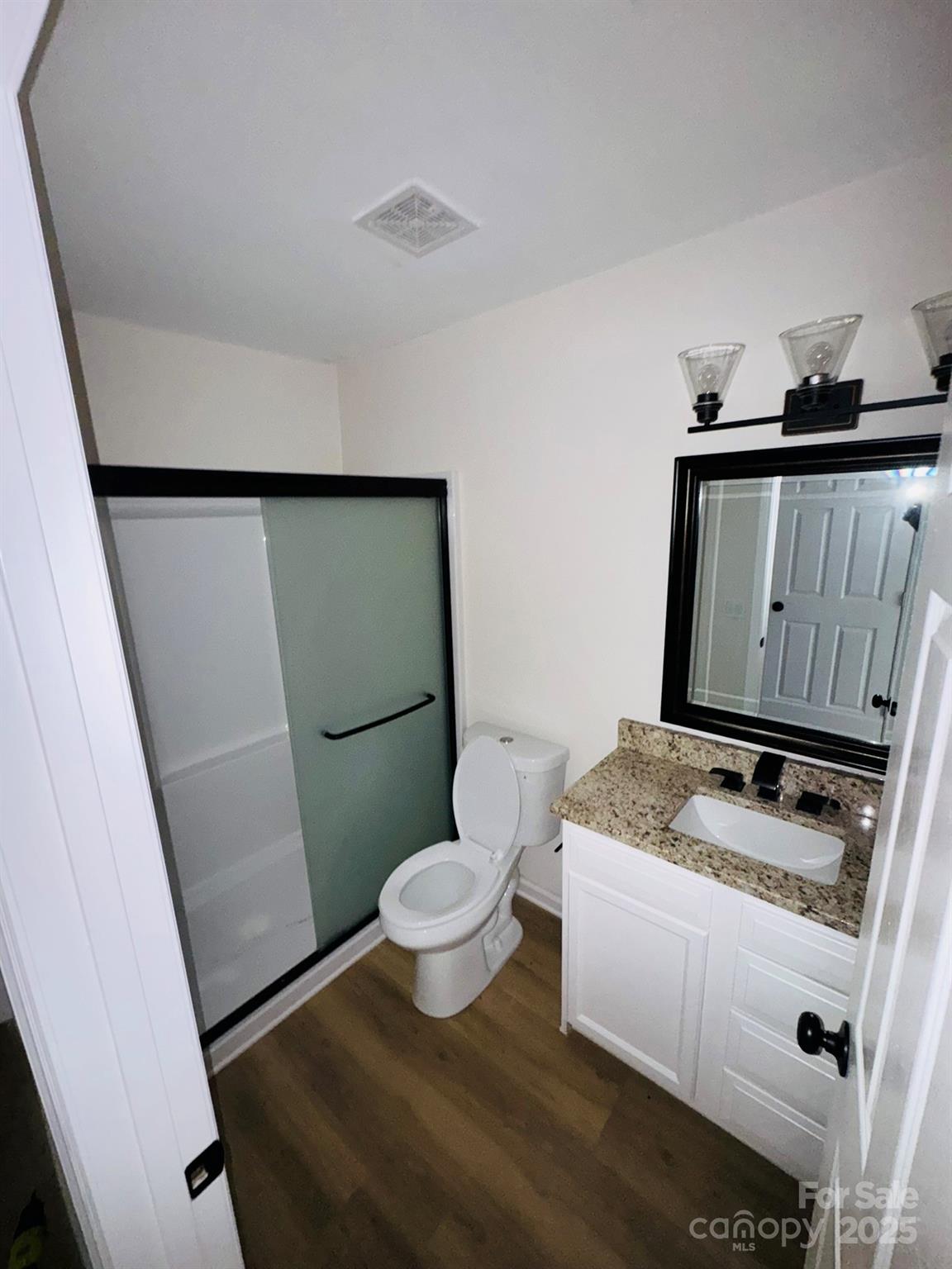 229 Windsor Point Road Columbia, SC 29223 - Photo 5 of 8 a bathroom with a granite countertop sink toilet and shower