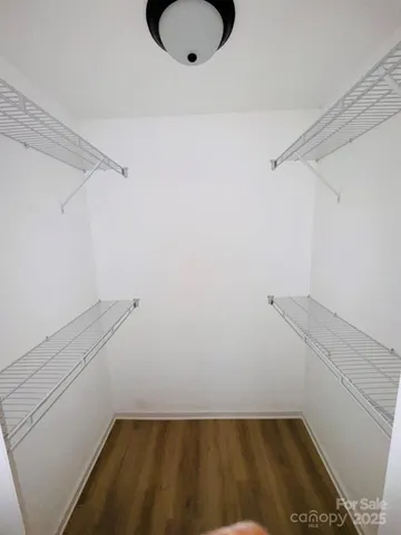 a view of a room with racks on the wall