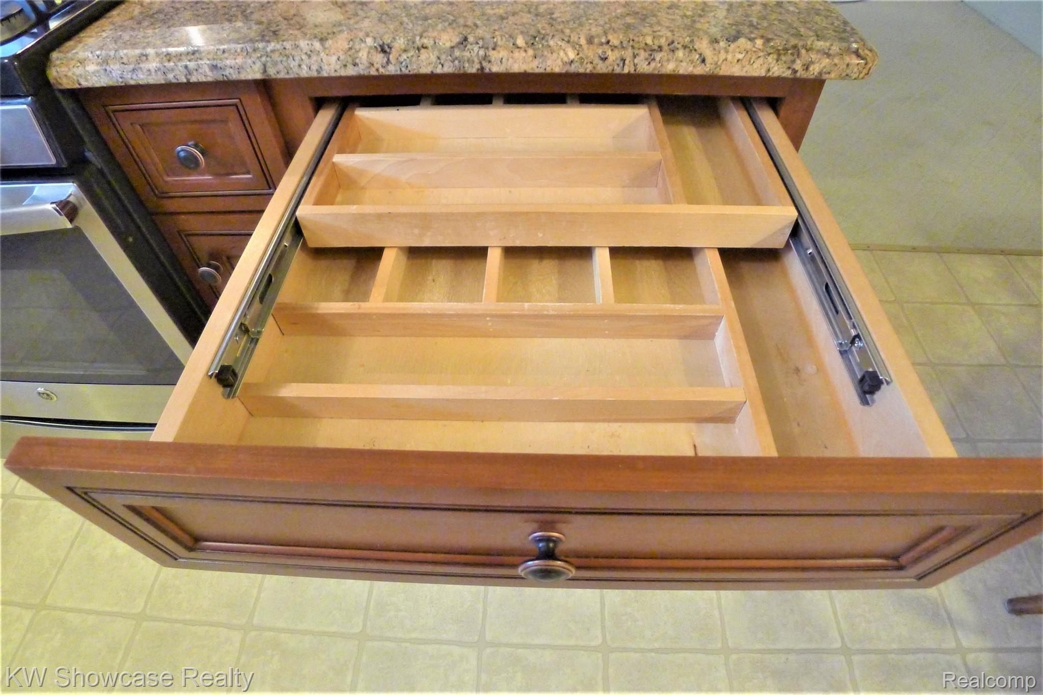 34264 Greentrees Road Sterling Heights, MI 48312 - Photo 15 of 42 Two tiered sliding layered silverware drawer.
