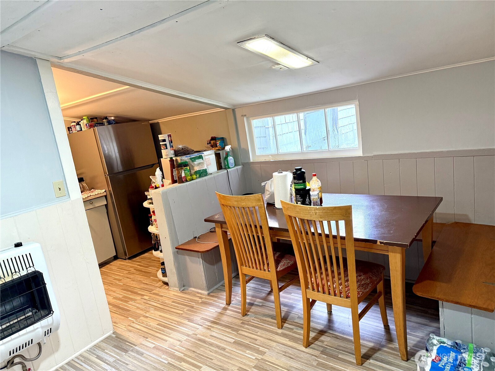 11040 11th Avenue Southwest Seattle, WA 98146 - Photo 5 of 18 a view of a dining room with furniture and wooden floor