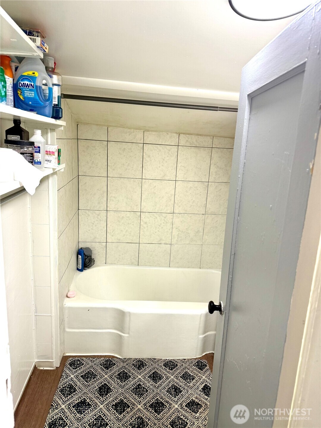 11040 11th Avenue Southwest Seattle, WA 98146 - Photo 9 of 18 a bathroom with a bathtub and a shower