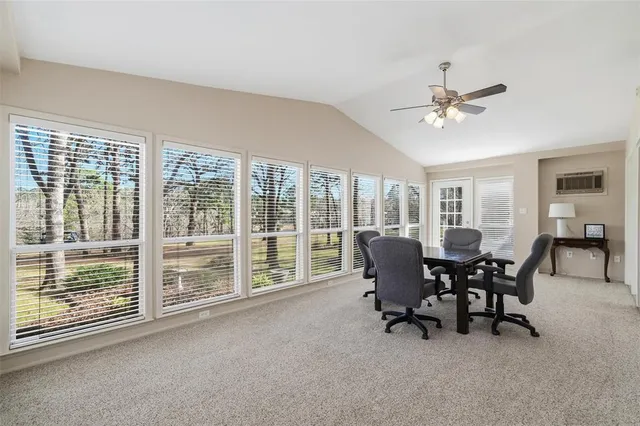 a view of a livingroom with furniture and a window