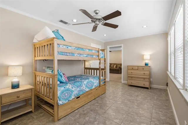 a bedroom with bed and a window