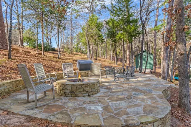 a view of a backyard with sitting area