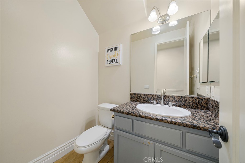 527 Fifth Avenue, Unit B Arcadia, CA 91006 - Photo 13 of 33 a bathroom with a granite countertop sink a toilet and a mirror