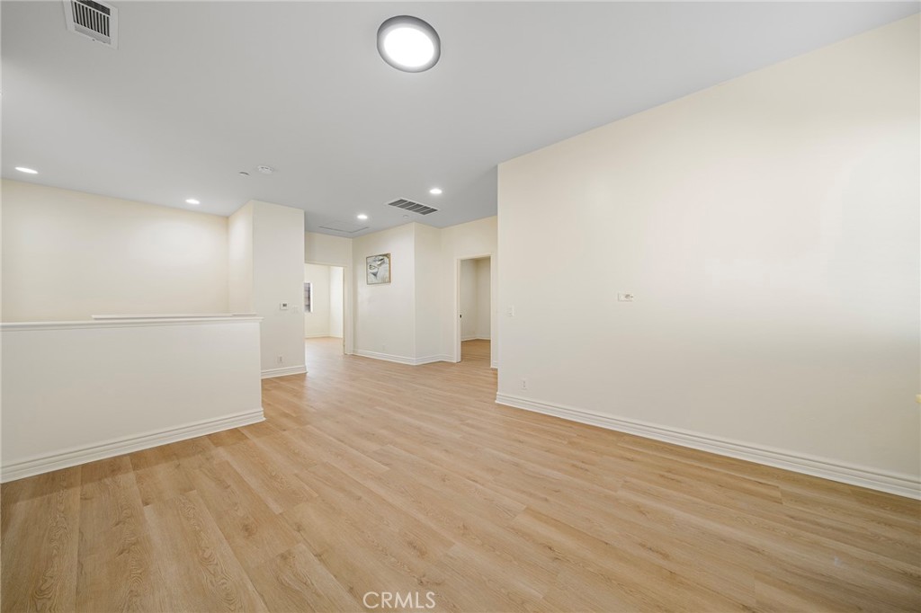 527 Fifth Avenue, Unit B Arcadia, CA 91006 - Photo 15 of 33 an empty room with wooden floor and windows