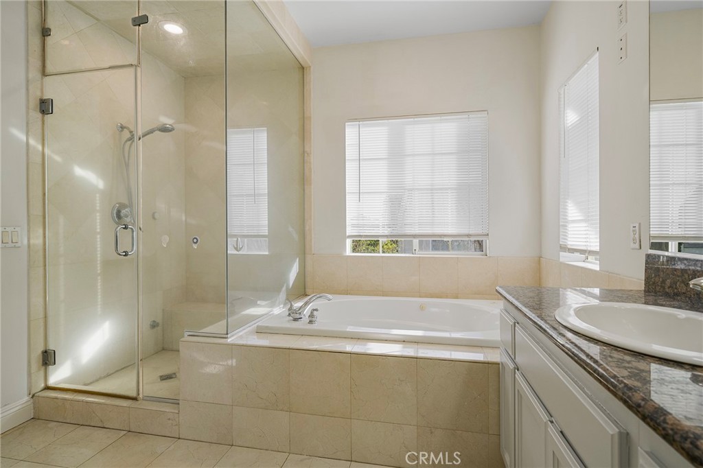 527 Fifth Avenue, Unit B Arcadia, CA 91006 - Photo 21 of 33 a bathroom with a granite countertop sink a toilet and shower