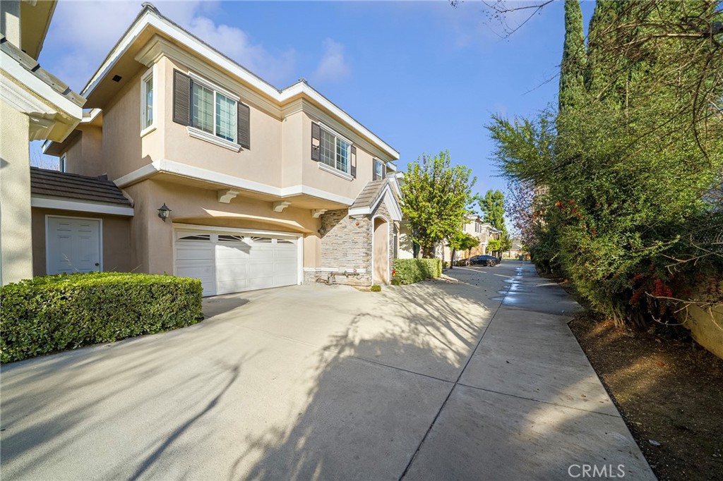 527 Fifth Avenue, Unit B Arcadia, CA 91006 - Photo 27 of 33 a front view of a house with a yard and a garage