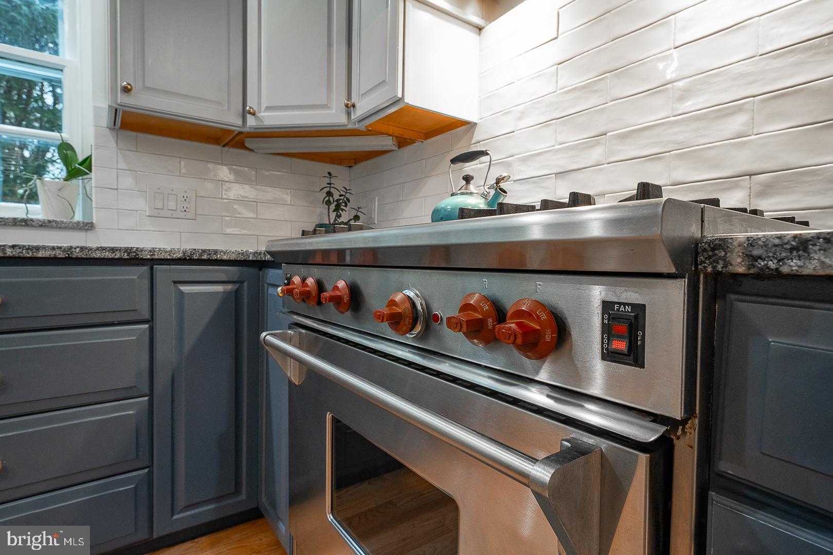 214 Kent Road Ardmore, PA 19003 - Photo 42 of 83 SS range and range hood with tile backsplash