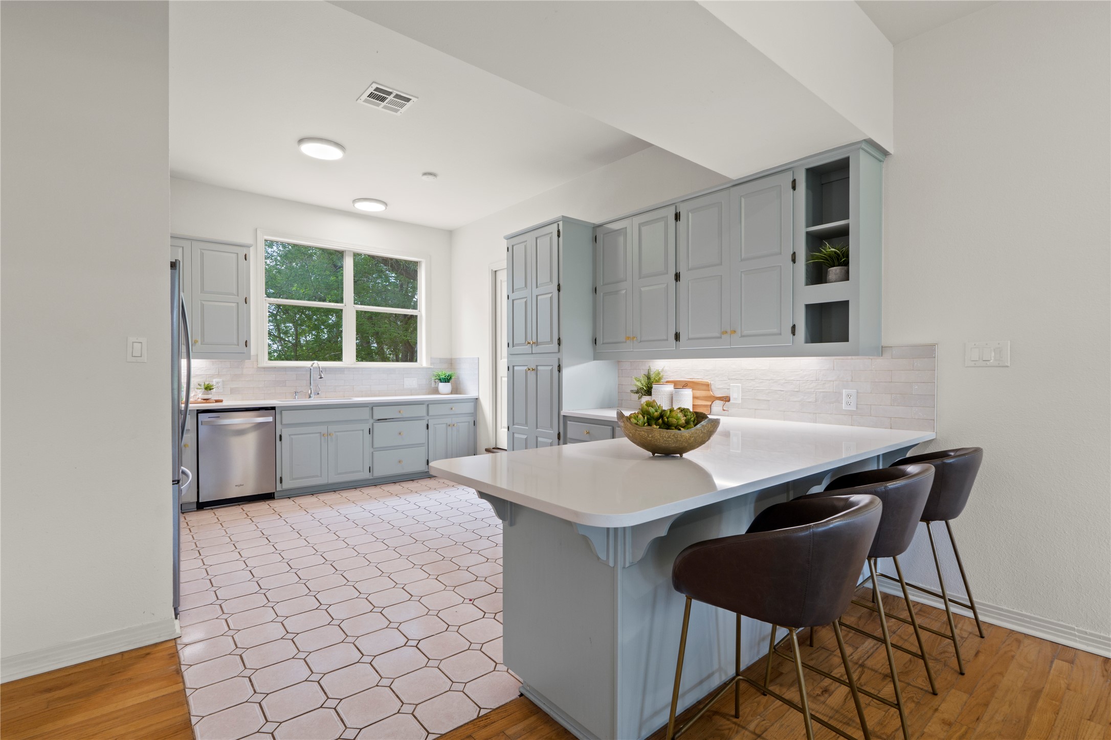 1700 Patterson Road Austin, TX 78733 - Photo 8 of 36 Updated kitchen with quartz countertops and breakfast bar