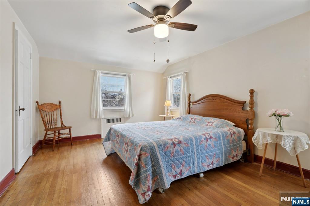 401 Walnut Street Nutley, NJ 07110 - Photo 12 of 25 a bedroom with a bed and a window