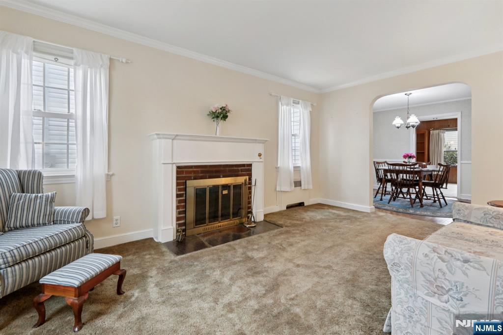 401 Walnut Street Nutley, NJ 07110 - Photo 4 of 25 a living room with furniture and a fireplace