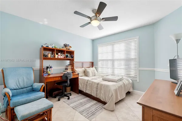 a bedroom with a bed and a couch