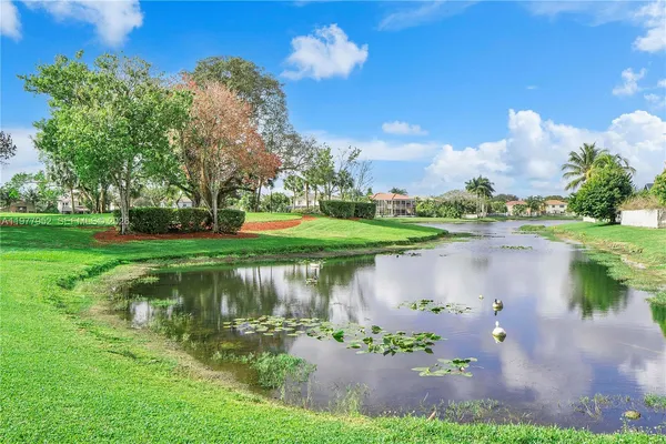 a view of a lake with a house in the background