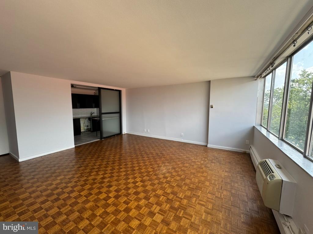 1401 Pennsylvania Avenue, Unit 612 Wilmington, DE 19806 - Photo 2 of 37 wooden floor in an empty room and a window