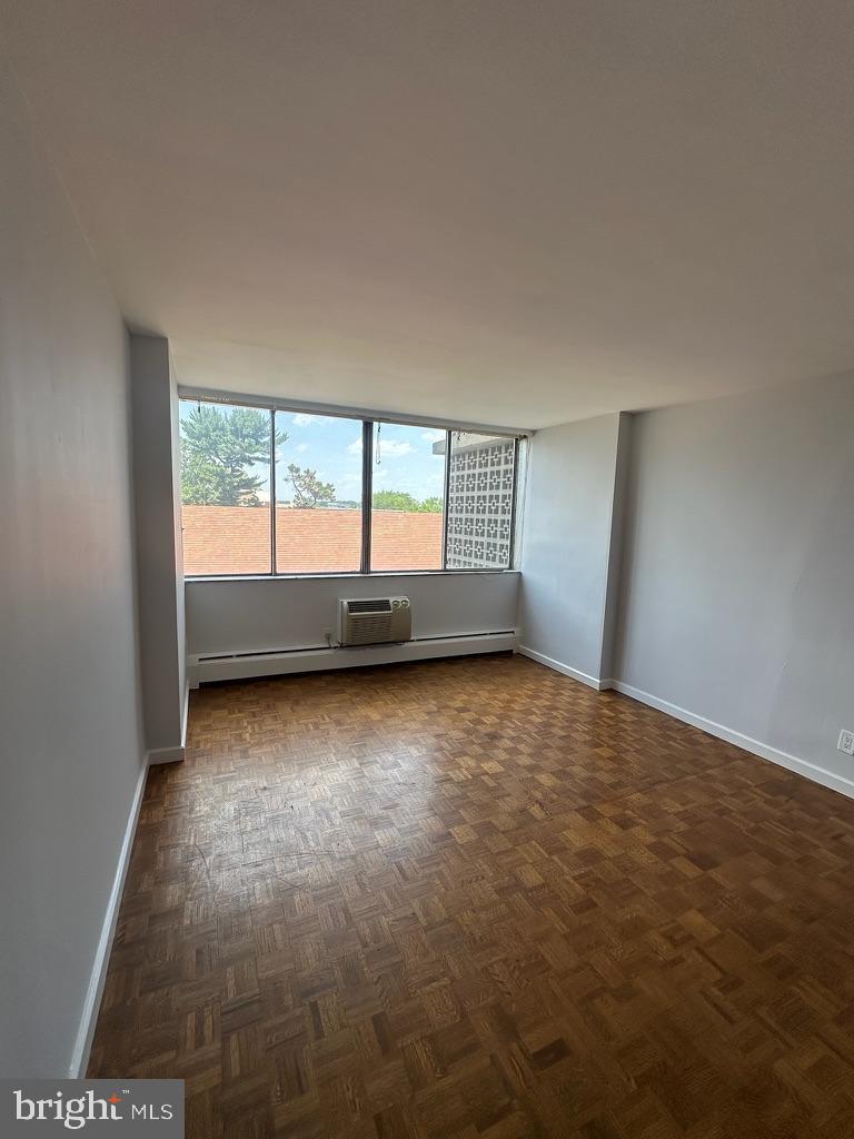 1401 Pennsylvania Avenue, Unit 612 Wilmington, DE 19806 - Photo 22 of 37 an empty room with large windows