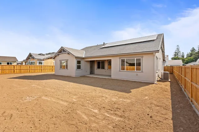 a view of a house with a snow in the background
