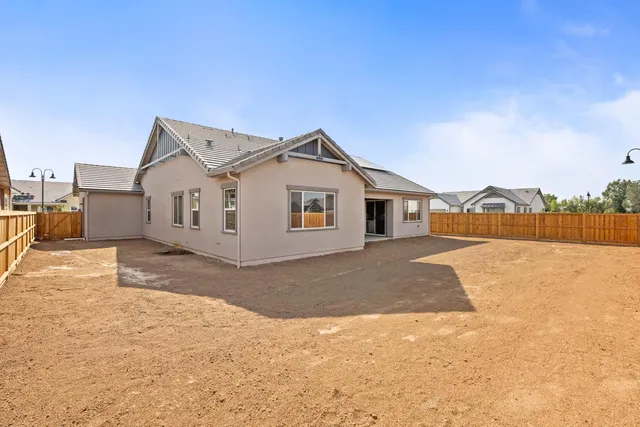 a view of living room kitchen with stainless steel appliances kitchen island