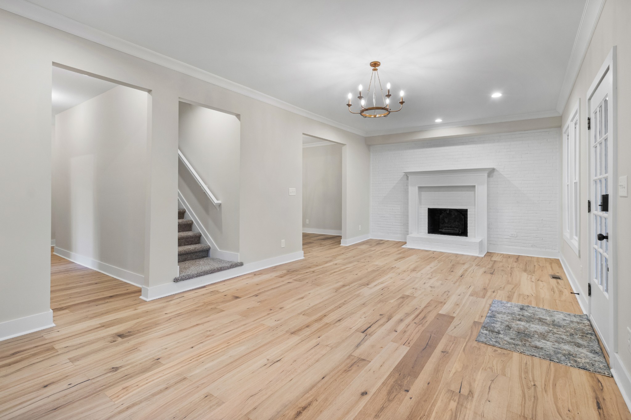 2028 Lock B Road North Clarksville, TN 37043 - Photo 9 of 47 wooden floor in an empty room with a fireplace
