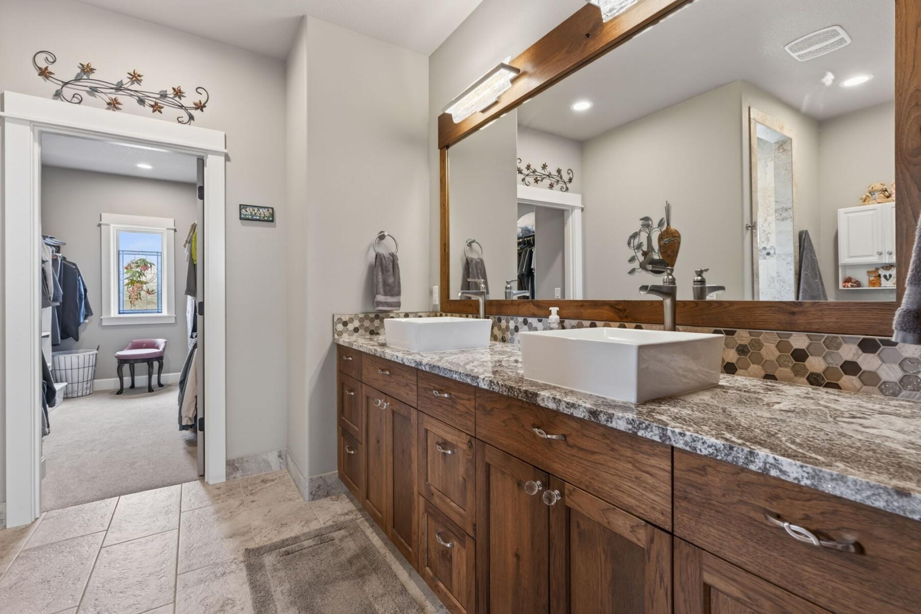 11620 Southwest Pixie Lane Culver, OR 97734 - Photo 25 of 53 a bathroom with a granite countertop sink and a mirror