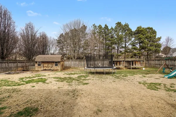 a house with trees in the background