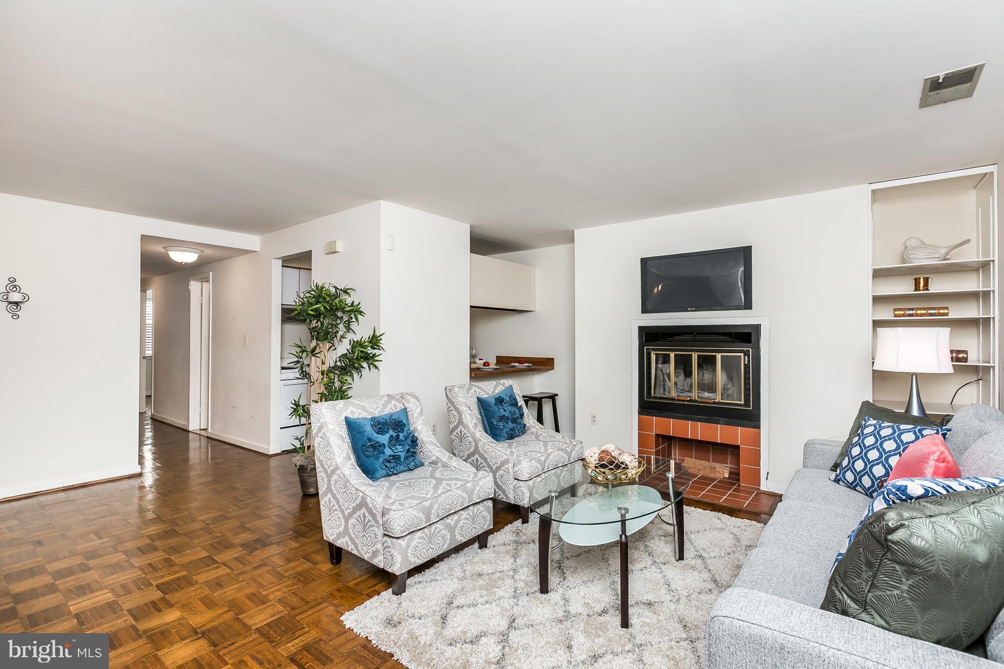 123 West Conway Street, Unit R58 Baltimore, MD 21201 - Photo 5 of 28 Cozy wood burning fireplace and built-in shelves.