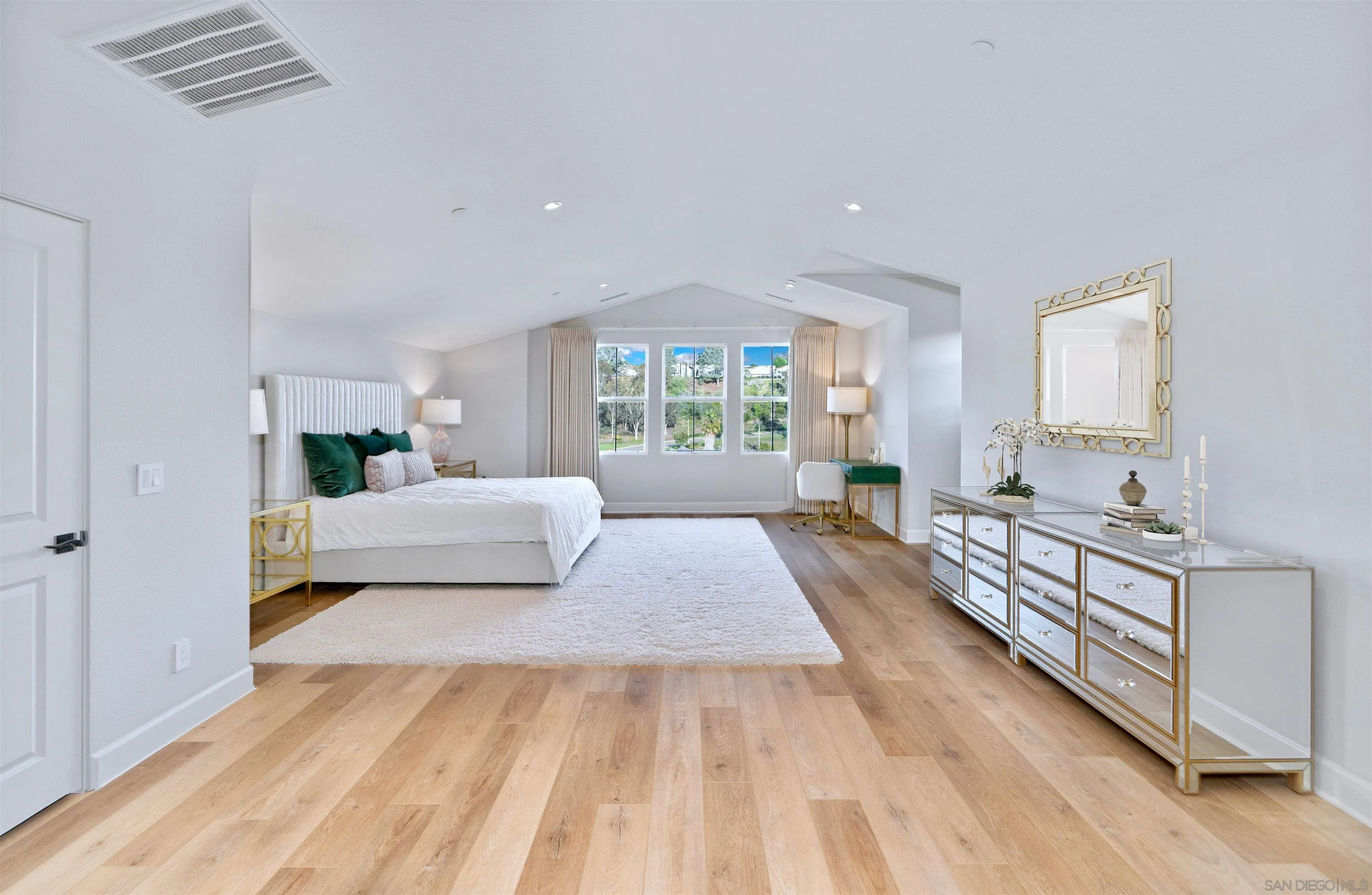 1259 Berryman Canyon Encinitas, CA 92024 - Photo 22 of 36 a bedroom with a large bed and a window