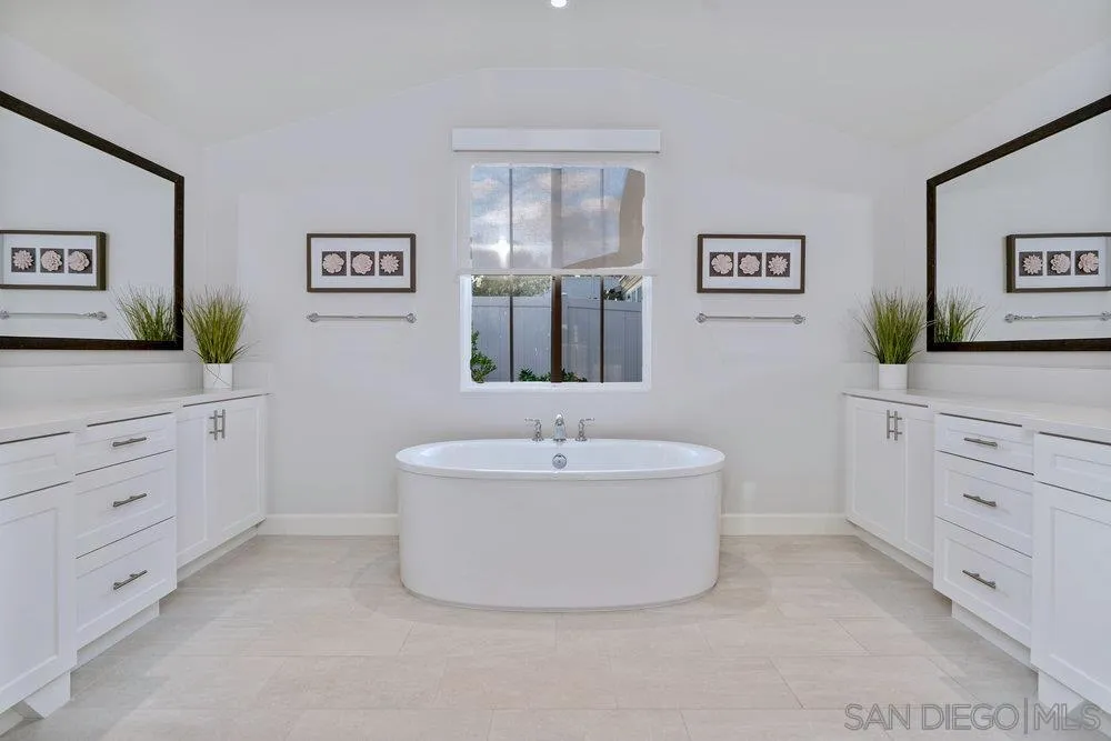 1259 Berryman Canyon Encinitas, CA 92024 - Photo 24 of 36 a bathroom with a sink mirror and a bathtub