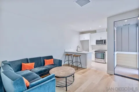 a living room with furniture and a table