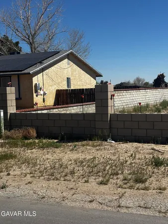 a view of a backyard of the house