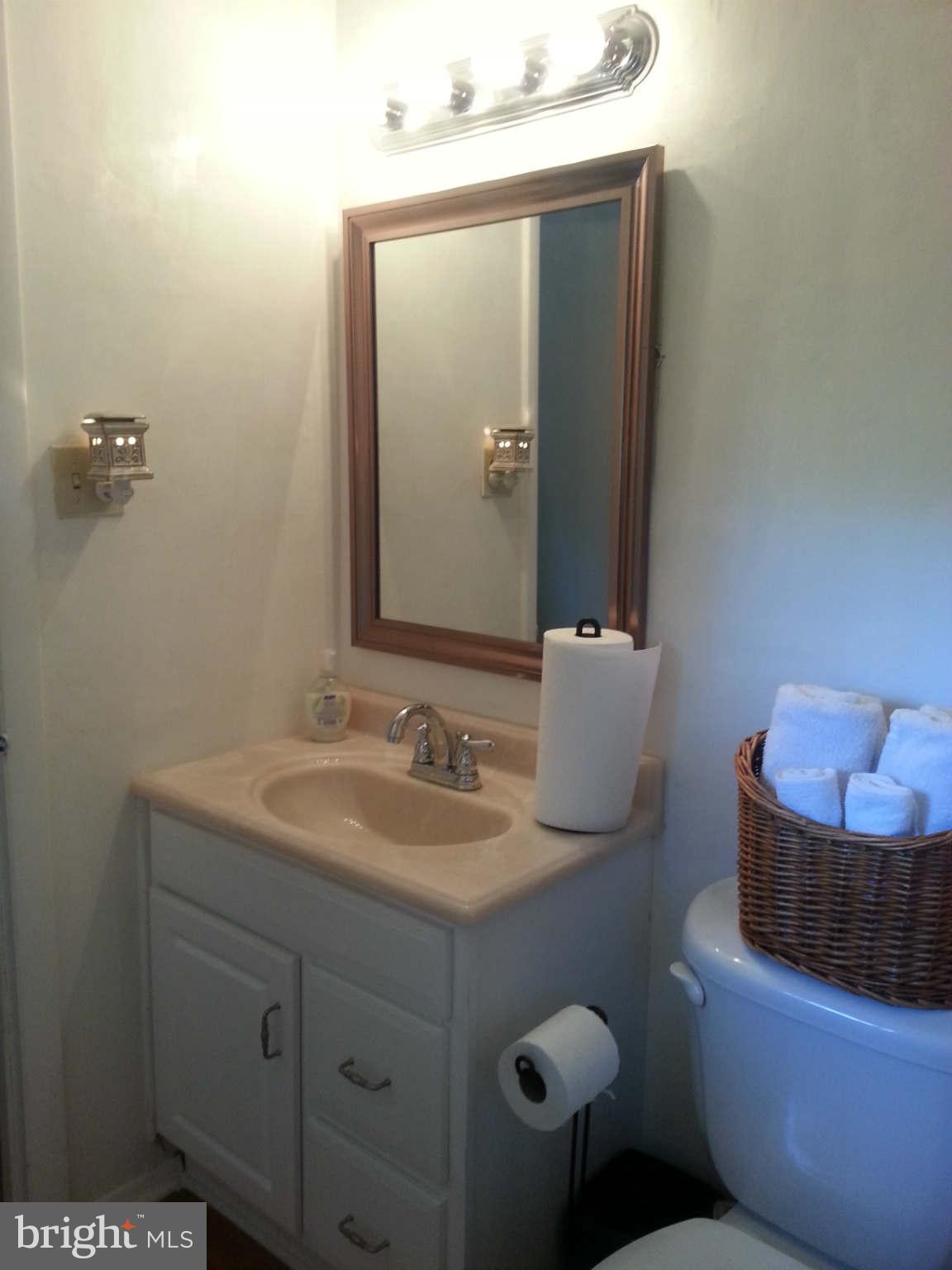 8258 Brattle Road Baltimore, MD 21208 - Photo 15 of 24 Master Bath with New Vanity & Sink and HW Floors
