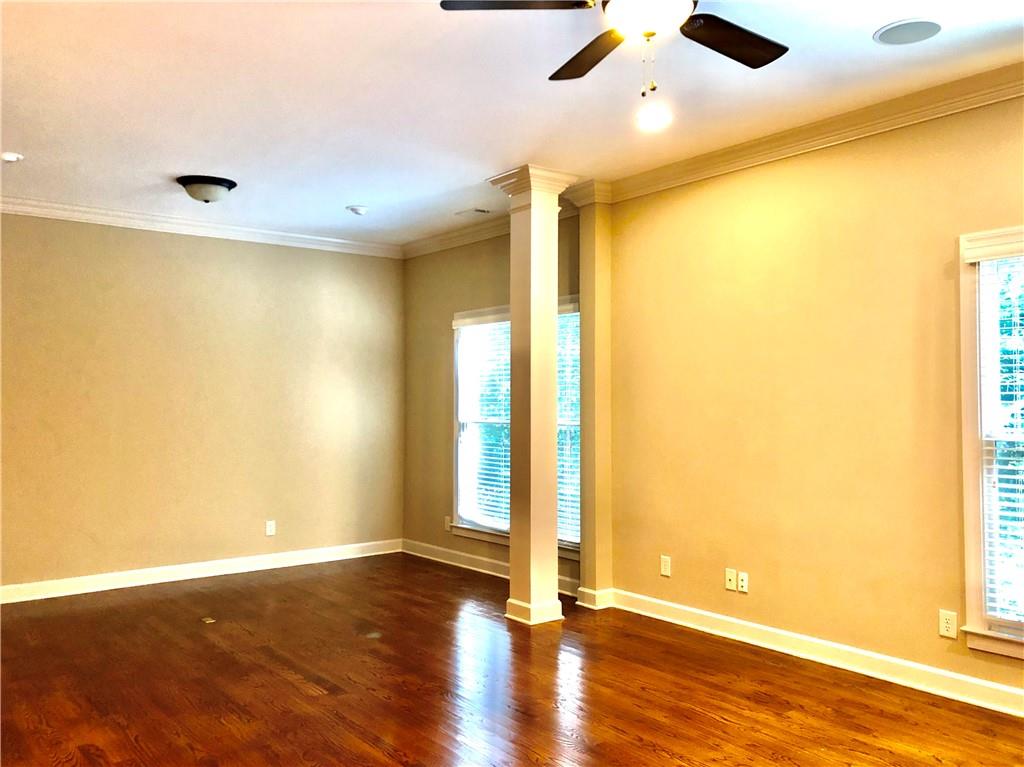 10575 Bent Tree View Duluth, GA 30097 - Photo 7 of 20 a view of a big room with wooden floor and windows