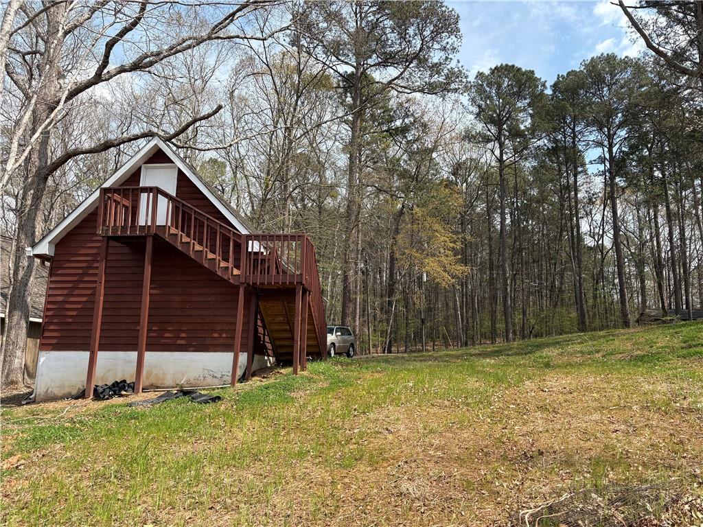 139 Bear Creek Road Eatonton, GA 31024 - Photo 5 of 8 a front view of a house with a yard